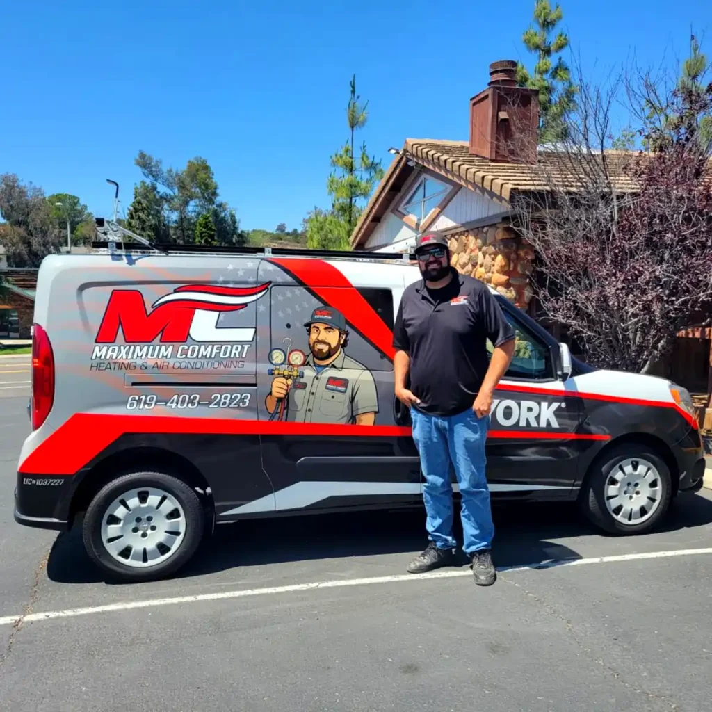 chris jaggi owner of maximum comfort standing next to an HVAC van